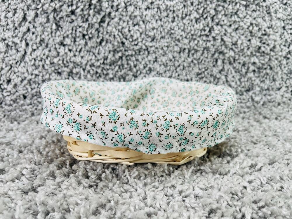 Small Wicker Basket With a Removable Cloth Liner Featuring a Teal Floral Pattern